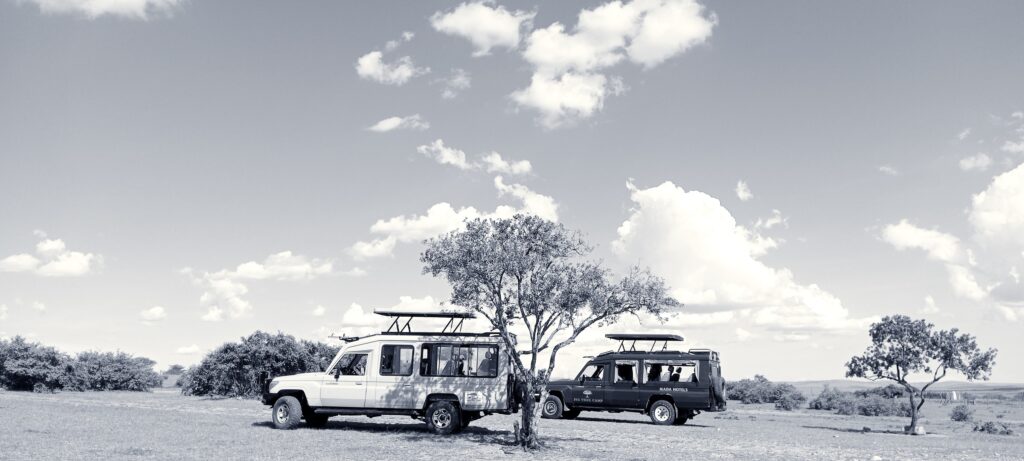 clients under a shade as they wait for the Masaai Culture Tour